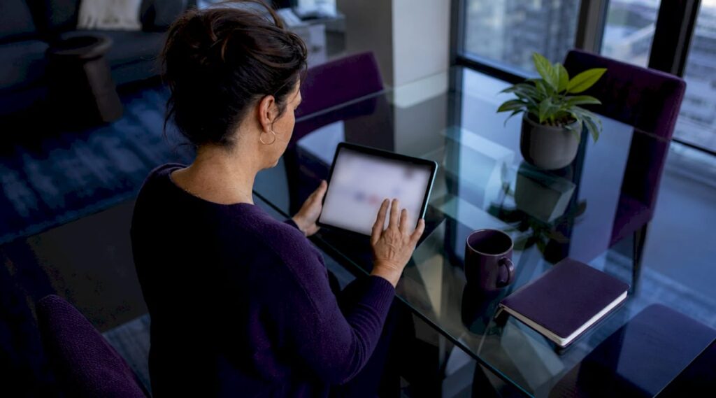 Woman browsing mental health resources on tablet